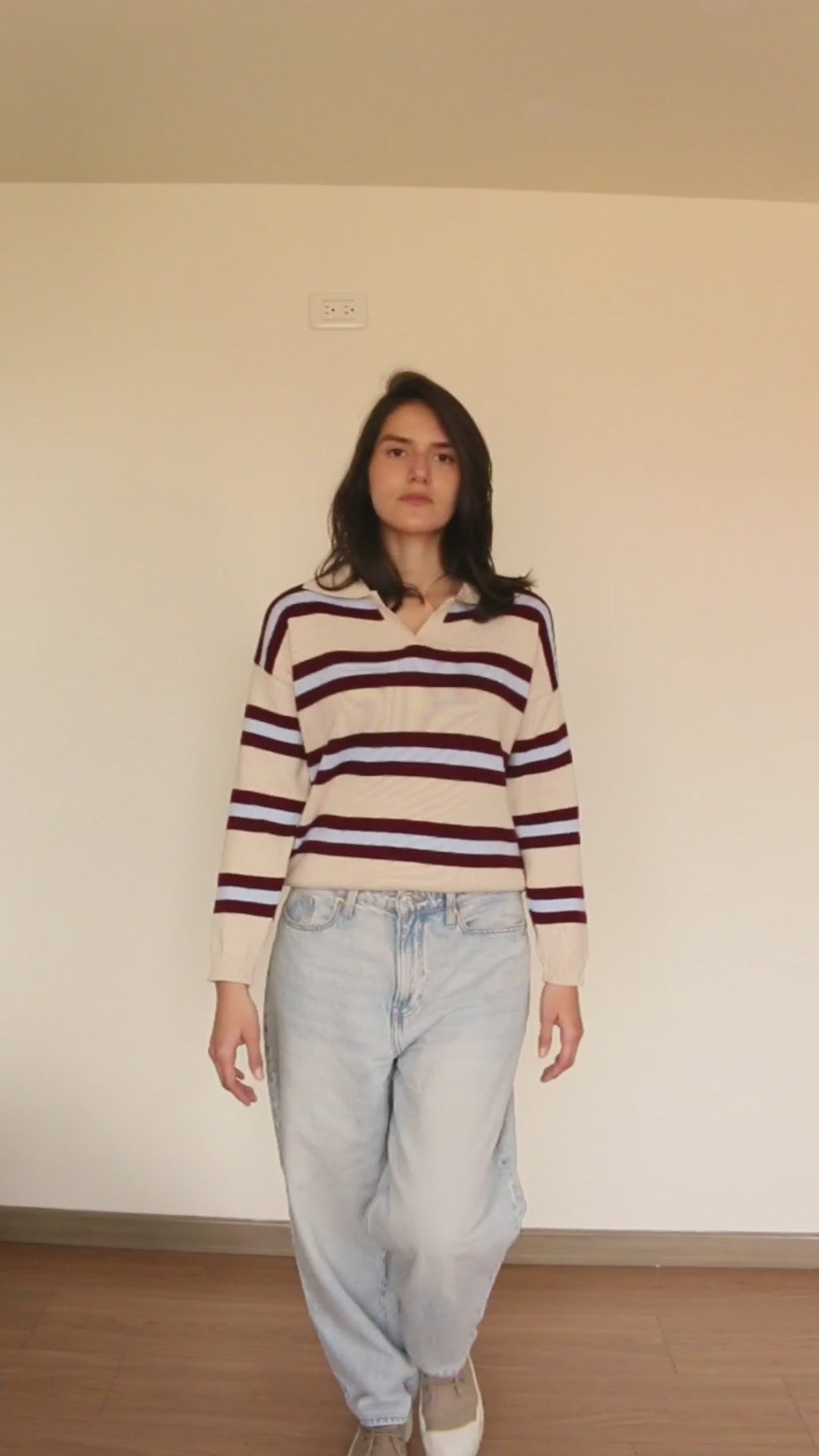 Sweater crema a rayas